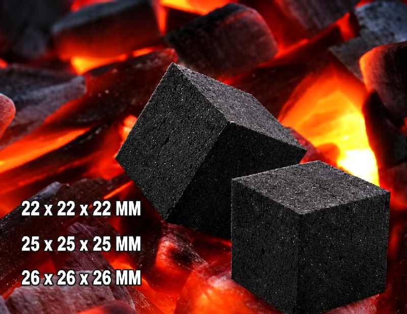 Cube-shaped coconut shell charcoal briquettes on glowing embers