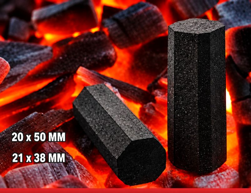 Hexagon-shaped coconut shell charcoal briquettes on glowing embers